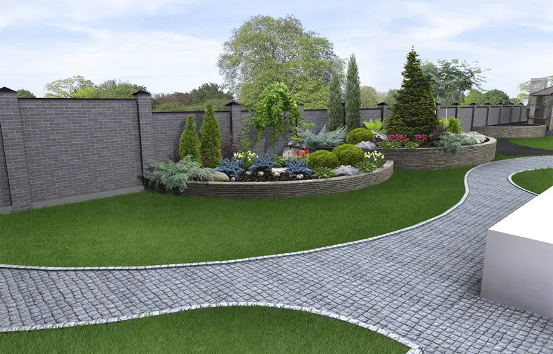 Curved cobblestone paver path in a modern landscaped garden